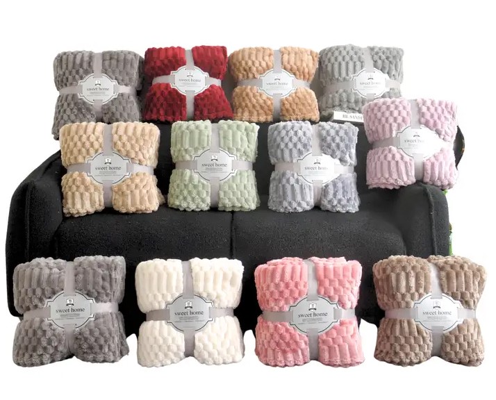 Seamstress hand-sewing a Minky Couture style plush blanket panel